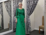 Video of a Elegant full-length green gown with lace bodice and draped skirt Video of a Elegant full-length green gown with lace bodice and draped skirt
