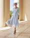 Tea-length mother of the bride dress in soft blue crepe