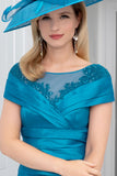 Elegant woman in teal dress and matching hat with beaded embellishments, showcasing a high-fashion special occasion look from Ever Elegant's designer collection. Elegant woman in teal dress and matching hat with beaded embellishments, showcasing a high-fashion special occasion look from Ever Elegant's designer collection.