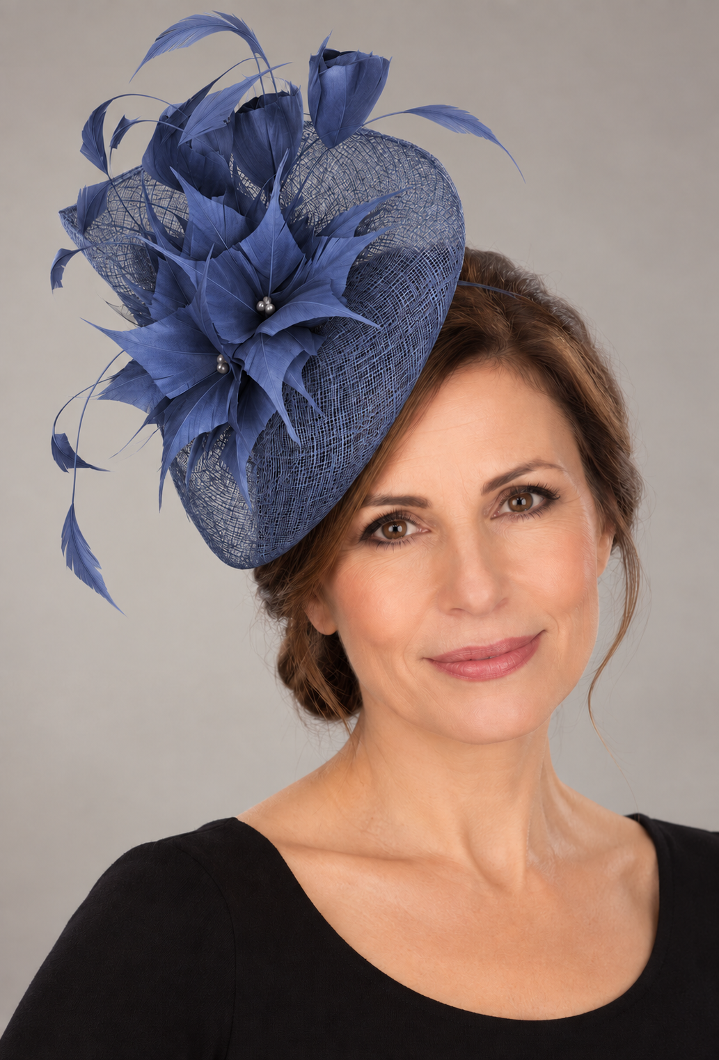 Soft royal blue fascinator with feather flowers and pearl accents