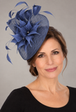 Soft royal blue fascinator with feather flowers and pearl accents