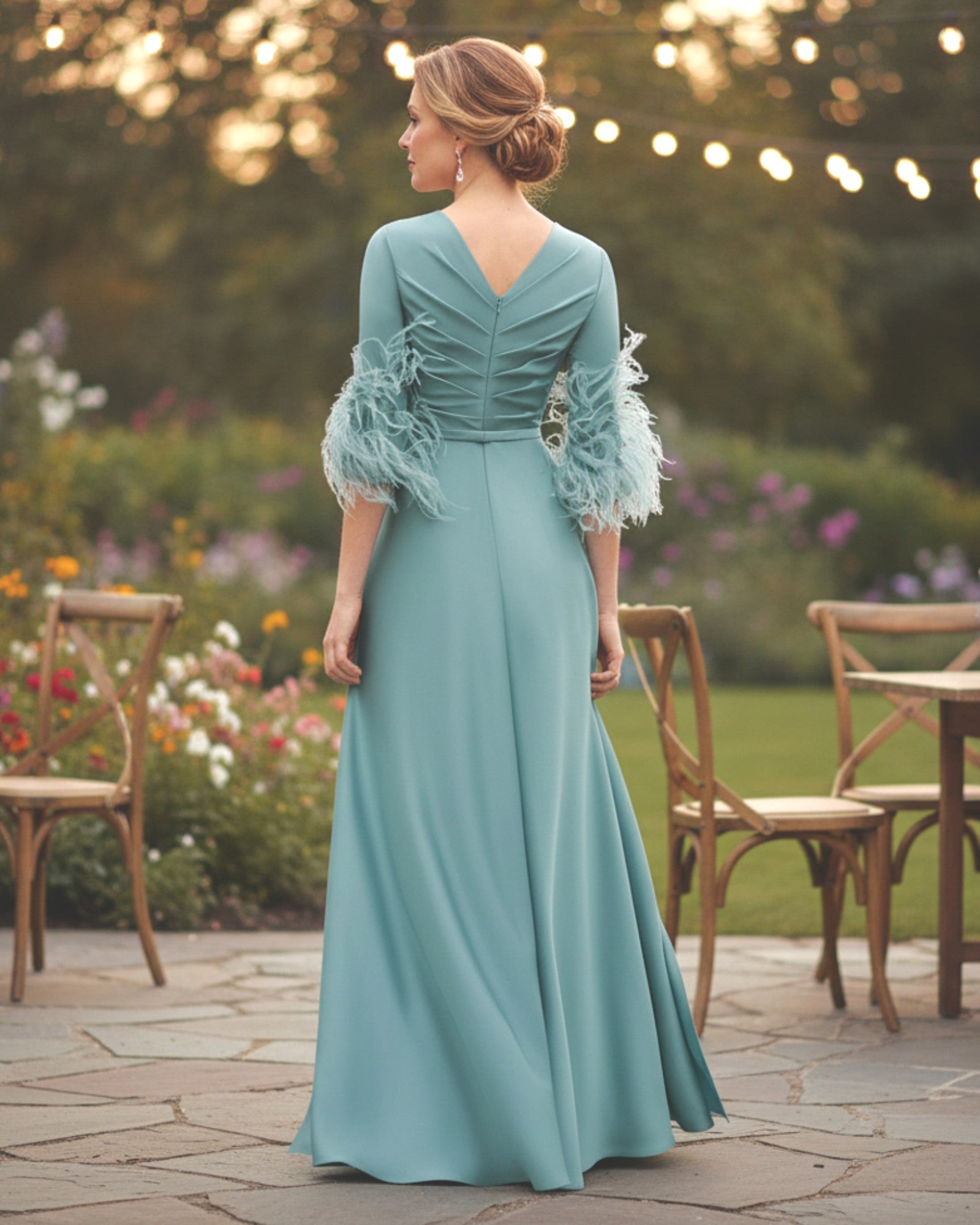 Celadon jumpsuit with V-back and three-quarter sleeves for the mother of the bride