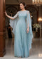 Soft blue beaded mesh gown with a long sheer beaded cape for a formal wedding.