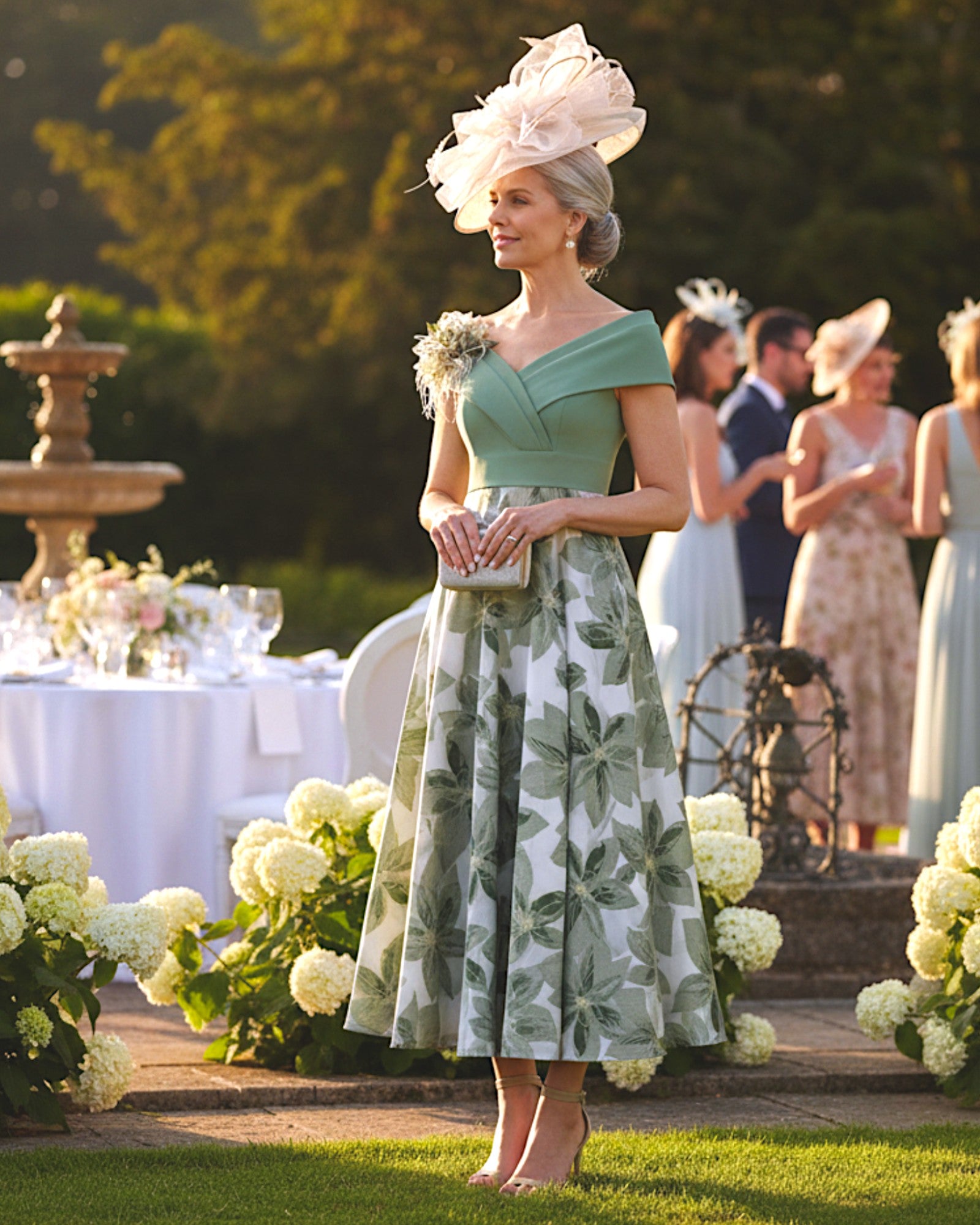 Sage off the shoulder mother of the groom dress perfect for a garden wedding.

