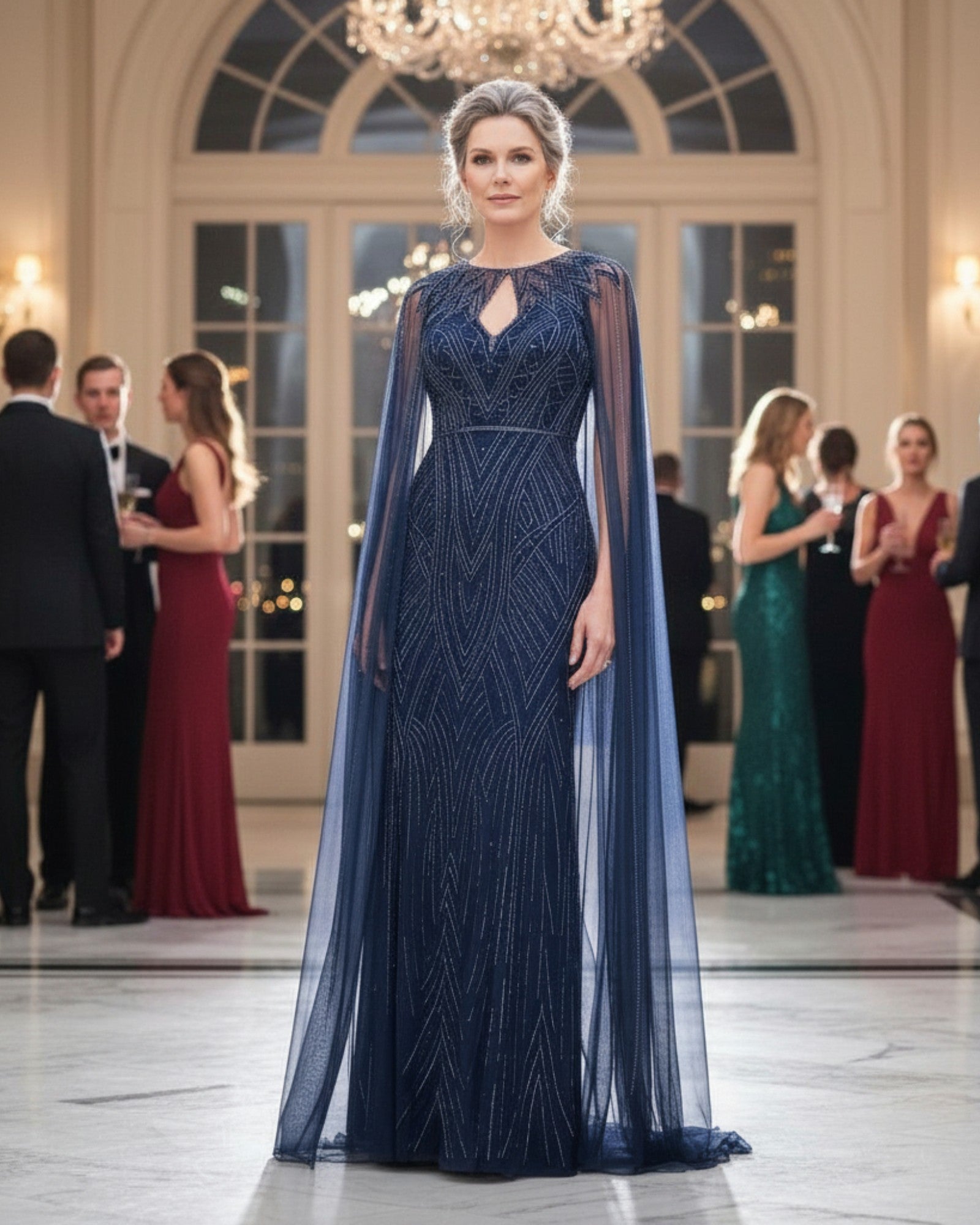 Navy beaded long gown with a full-length beaded mesh cape.