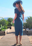 Elegant crepe dress with pearl waist detail and bow
