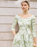 The front view of the Mother of the groom dress in apple green floral print Mikado fabric