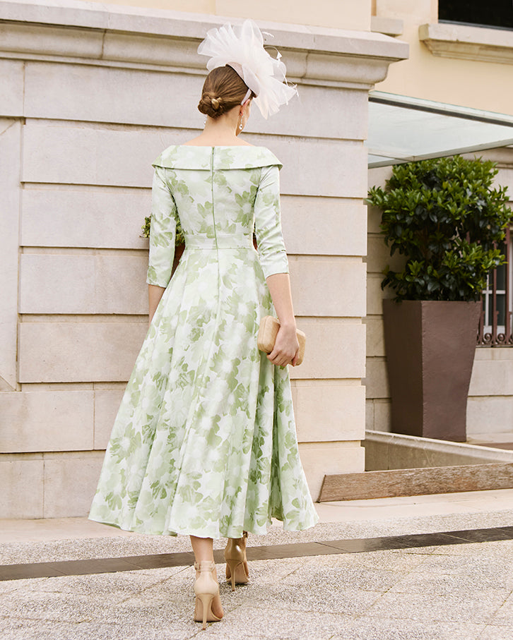 The back view of the Elegant tea-length mother of the bride outfit with V-neck and waist tie from Couture Club.