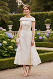 This elegant cream and gold mother of the bride dress is a refined and sophisticated choice for weddings and special occasions in Australia.