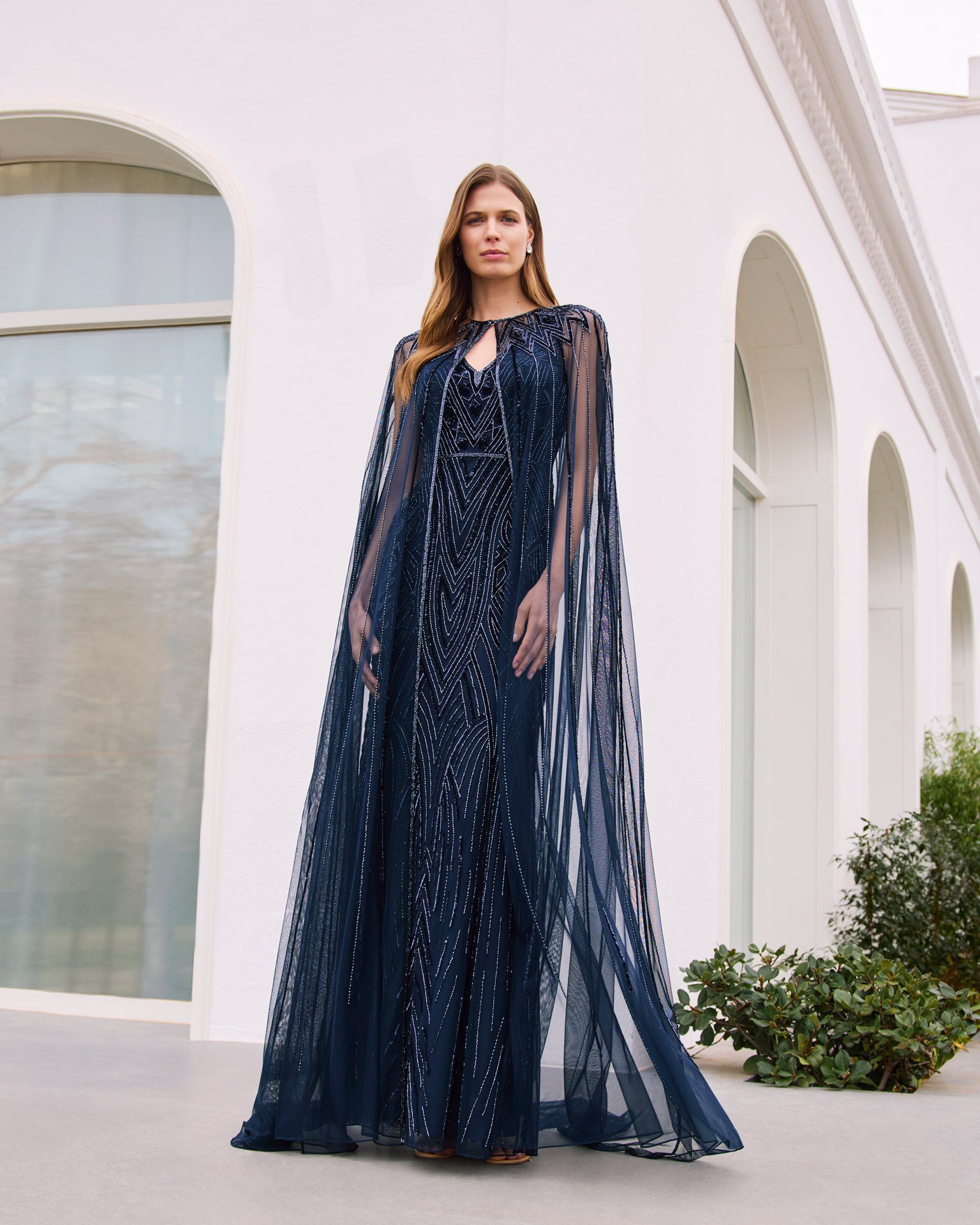 “Navy beaded evening gown with detachable sheer cape – Couture Club”