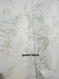 
Close-up of ivory cream brocade jacket fabric with buttery gold highlights and metallic thread detail