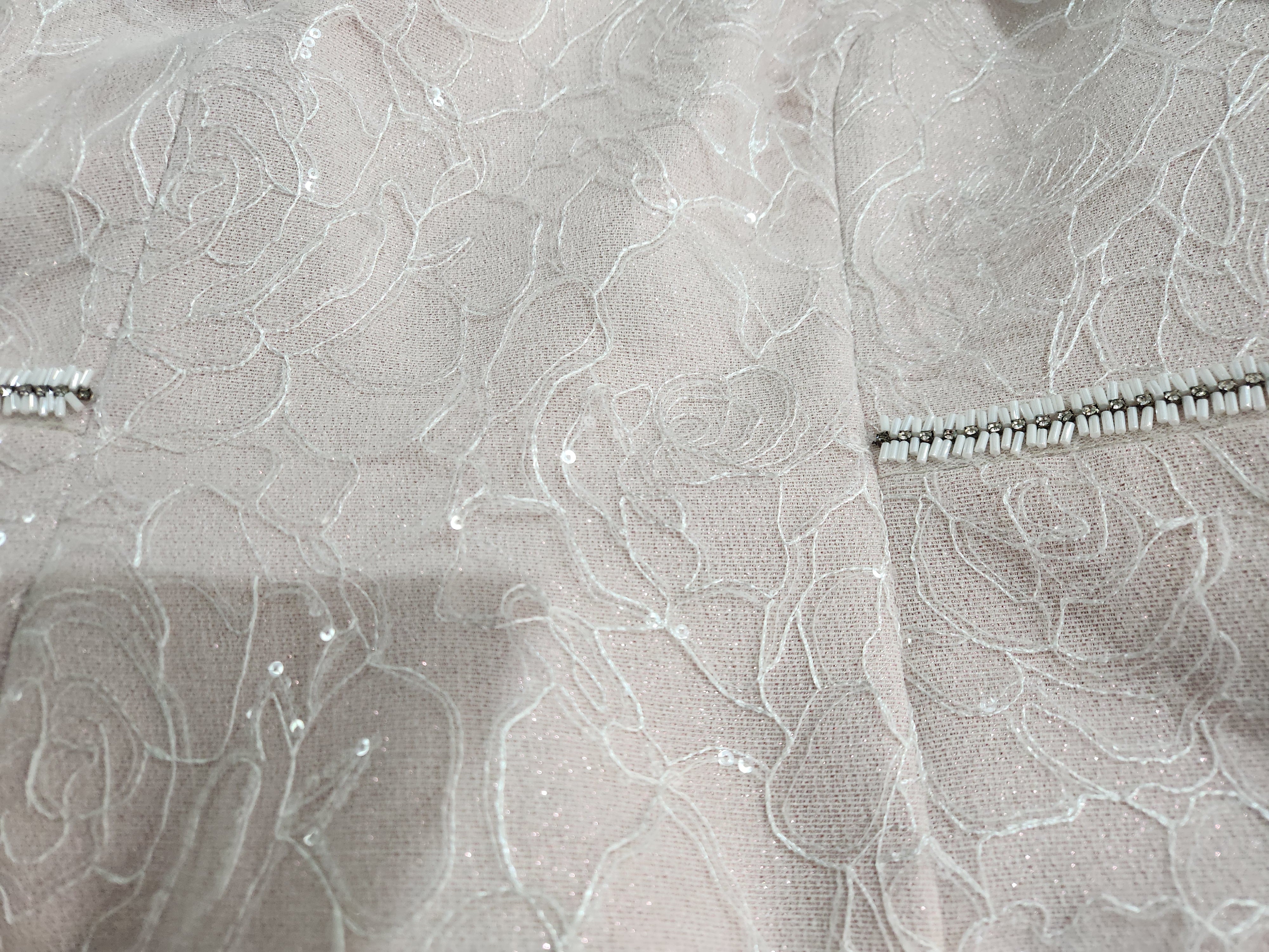Close up of dress fabric with beaded detail on the Sonia Pena dress and jacket for mother of the bride, groom or grandmothers.