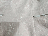 Close up of dress fabric with beaded detail on the Sonia Pena dress and jacket for mother of the bride, groom or grandmothers.