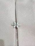 Clasp detail of the jacket on the mother of the bride dress and jacket from Sonia Pena, available in Melbourne.