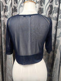 Back view of navy sheer cropped occasion jacket with coordinating trim
