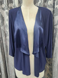Plus size navy jersey cropped jacket with a satin drape.