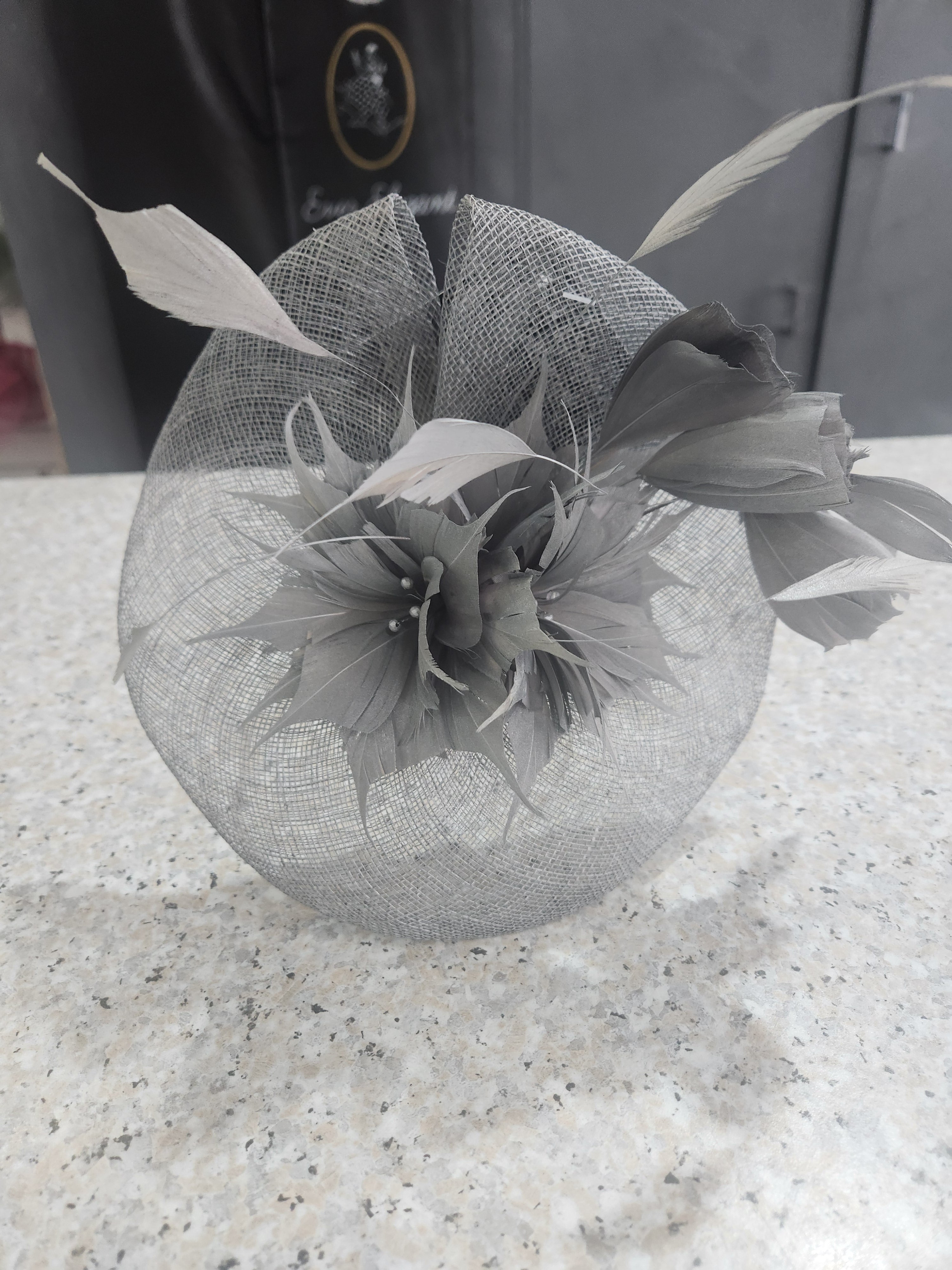 Metallic silver-grey fascinator for the mother of the bride