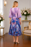 Lizabella floral mother of the bride dress in lilac and blue print, styled in Ever Elegant boutique Melbourne