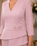 Close-up of embellished waist feature on Veni Infantino dusty pink occasion gown for weddings and special events