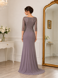 Back view of mauve formal gown with embroidered lace bodice, jersey skirt and elegant train