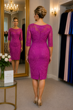 Back view of royal fuchsia occasion dress with sheer embroidered upper back, three-quarter sleeves and fitted pencil silhouette, modelled by an Ever Elegant size 14  model in boutique setting.