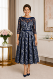 Navy lace mother of the bride dress size 20 with light silver backing and tea-length skirt