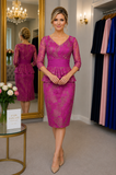 Designer fuchsia mother of the bride dress with lace sleeves, peplum waist detail and fitted knee-length skirt styled on mature size 12–14 model in Ever Elegant boutique Melbourne