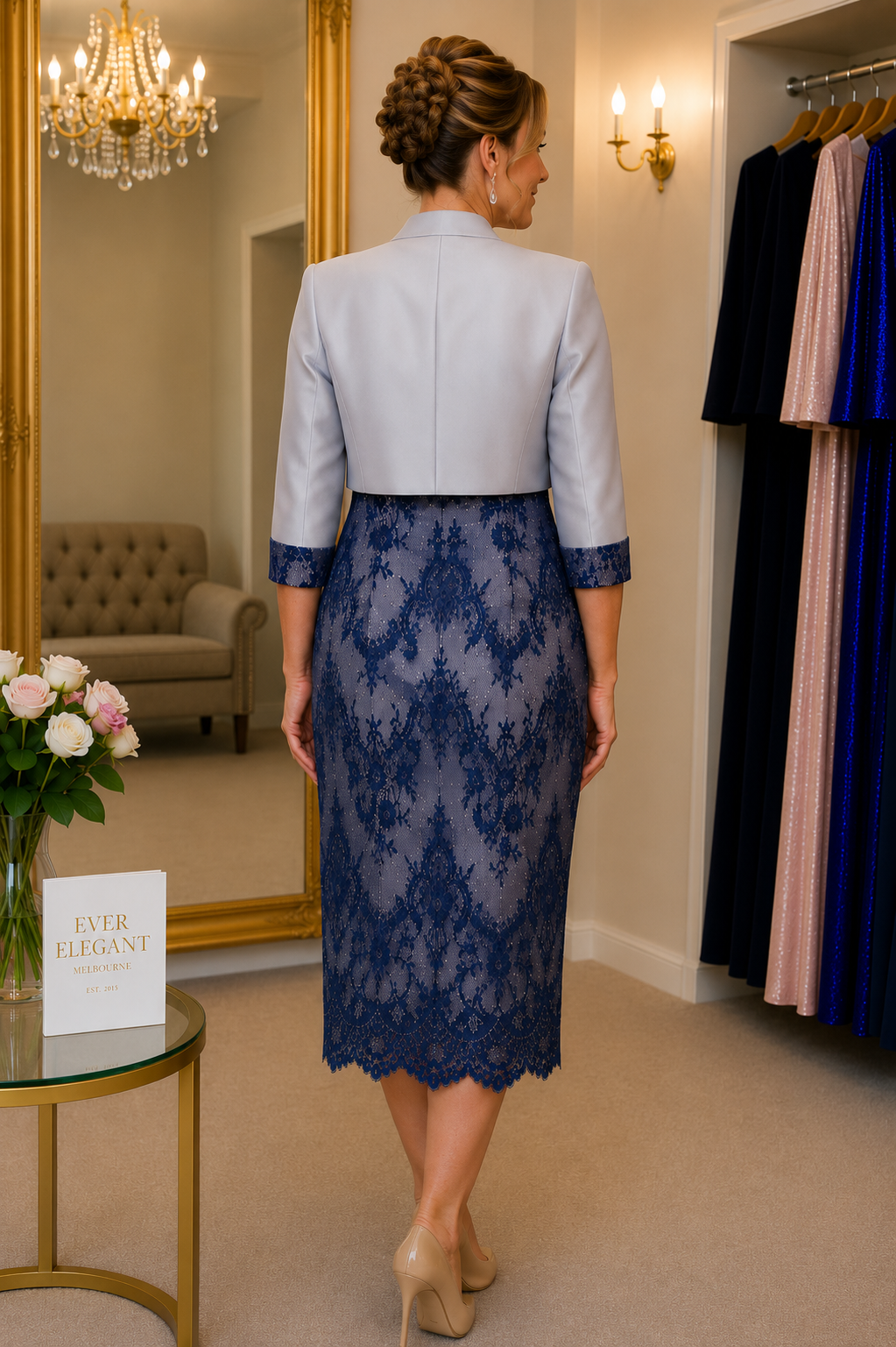 back view of navy and silver crepe mother of the bride dress with jacket.
