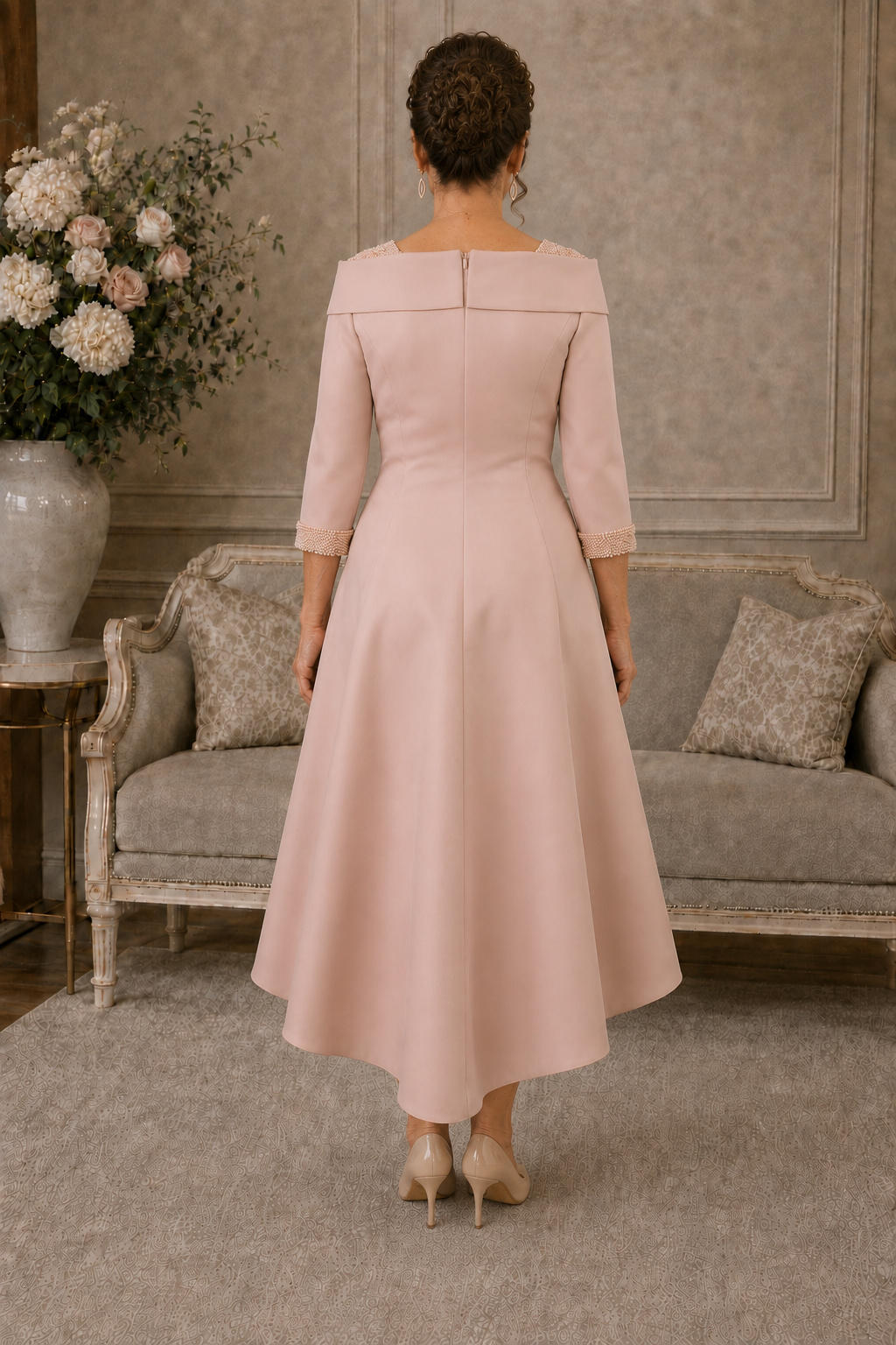 Back view of Couture Club peach pink Mikado dress with pearl cuffs and longer hem