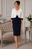 Navy and ivory mother of the bride dress with ruched skirt, ivory bodice and elegant jeweled neckline detail