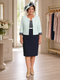 Plus-size navy and mint mother of the bride dress with matching cropped jacket and coordinating hat.