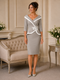 Taupe and ivory mother of the bride dress with off-shoulder neckline, ivory trim and elegant fitted below-knee silhouette