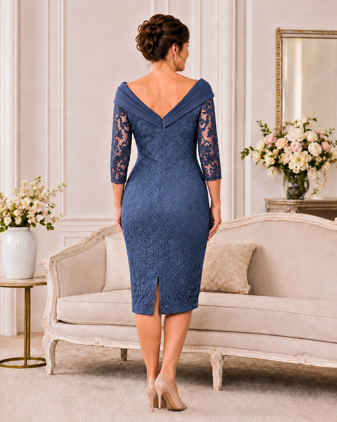 Back view of light navy Veni Infantino lace mother of the bride dress showing V-back collar, centre zip and skirt vent