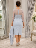 back view of a Mature woman wearing a silver grey mother of the groom outfit with matching jacket