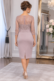 Mature woman wearing a soft mauve mother of the groom outfit with sheer jacket