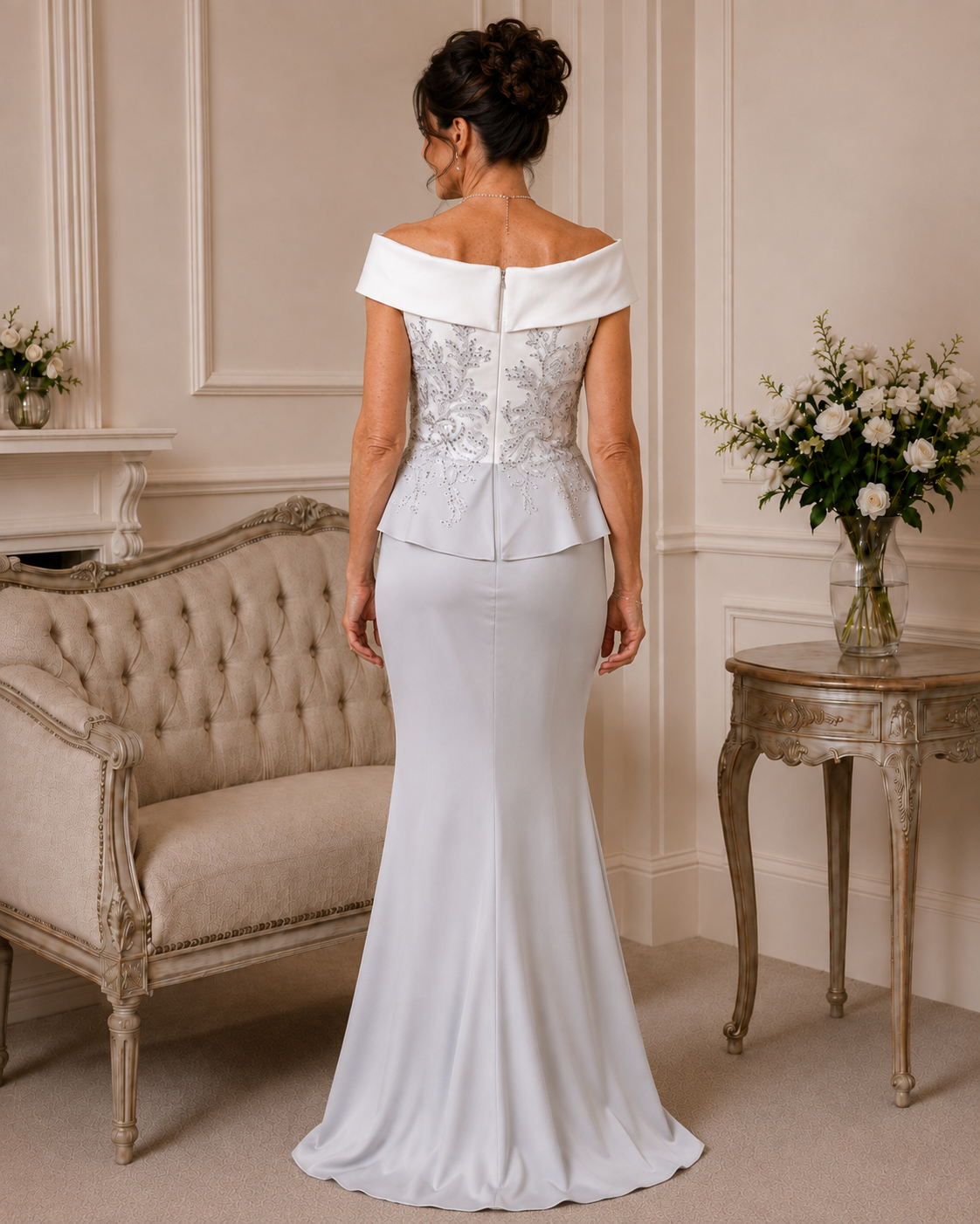 Back view of Veni Infantino silver and ivory formal gown showing beaded bodice, ivory neckline and full-length crepe skirt