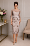 Champagne embellished lace mother of the bride dress with floral appliqué and sheer sleeves on a brunette size 12/14 model at Ever Elegant Melbourne.