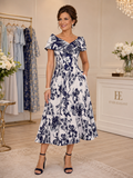 Front view of navy and ivory floral mother of the bride dress with folded neckline and full A-line midi skirt.