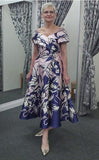 Veni Infantino fit and flare dress with beaded shoulder detail and pockets.