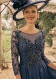 Veni Infantino light Navy midi length beaded lace and chiffon mother of the bride or Groom dress.

