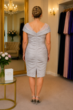 Back view of dove grey mother of the bride dress with elegant V-back illusion neckline, ruched fitted silhouette and knee-length skirt, displayed on a size 18 model in the Ever Elegant boutique.