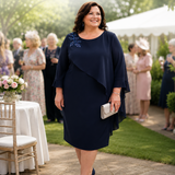 Veromia navy plus size mother of the bride dress with beaded shoulder detail and elegant drape overlay