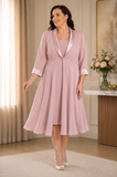 Plus size dusty pink mother of the bride dress and matching swing coat with satin collar detail, designed for wedding occasions and formal events.