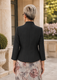 Back view of black tailored mother of the bride jacket showing fitted silhouette and structured collar, formal wedding outfit Australia