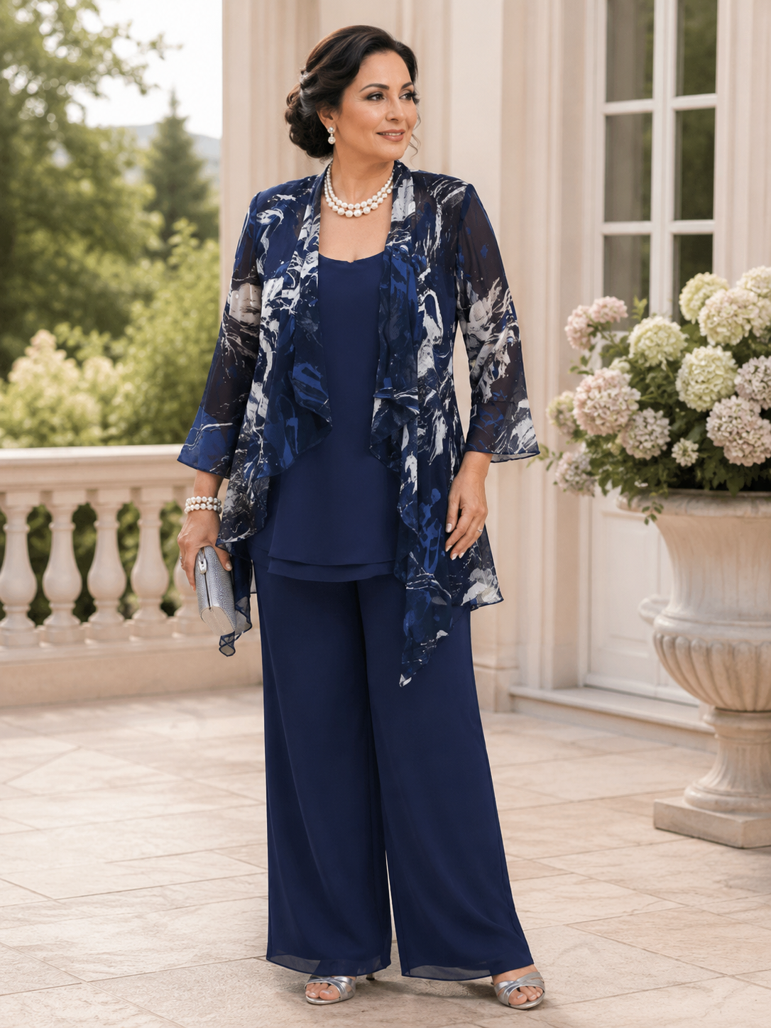 Elegant plus size mother of the groom outfit in navy featuring a hand-painted silk overlay jacket