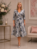 Silver and navy floral brocade fit-and-flare dress for mother of the bride or groom with 3/4 sleeves and elegant midi length