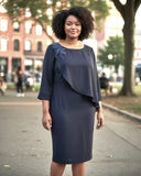 Elegant dark navy occasion dress with cape sleeve