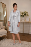 Silver brocade mother of the bride dress and matching long coat on mature brunette model