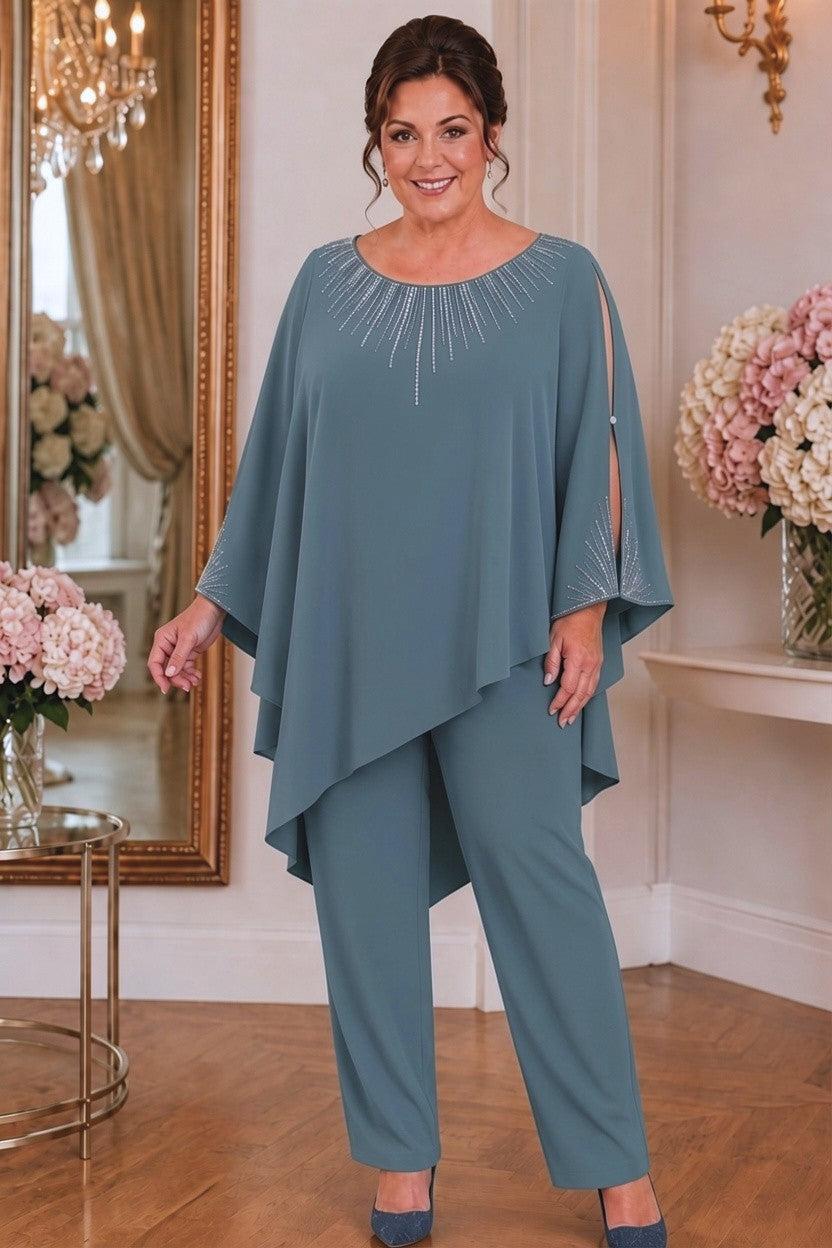 Plus-size dusty blue mother of the bride pantsuit with opaque asymmetric top and matching trousers