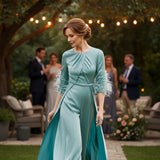 Couture Club celadon jumpsuit with flowing overskirt” for  the mother of the groom.